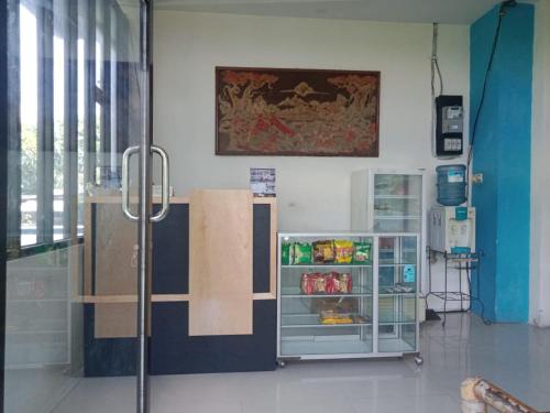 a room with a refrigerator in a room at Anyar in Mataram