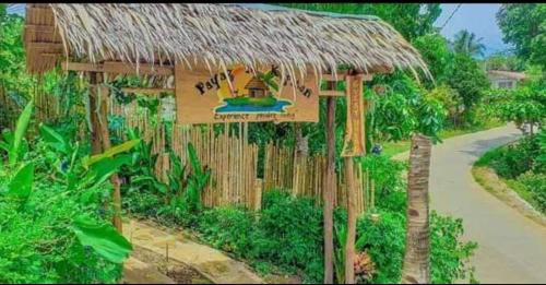 a sign for a resort with a small building at Payag n' Kapitan, Experience pinubre living in Siquijor