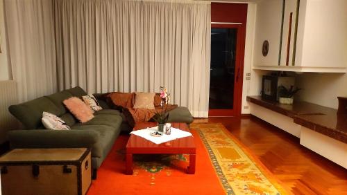 a living room with a couch and a coffee table at Villa Elena in Manerba del Garda