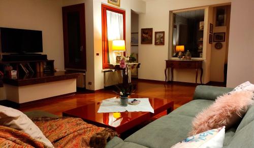 a living room with a couch and a table at Villa Elena in Manerba del Garda