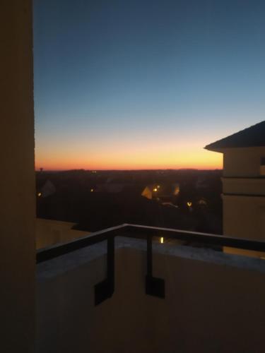 a sunset from the balcony of a building at "bienvenue" appartement T2 meublé in Savigny-le-Temple