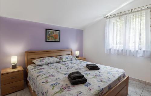 a bedroom with a bed with two towels on it at Nice Apartment In Pula With Kitchen in Pula