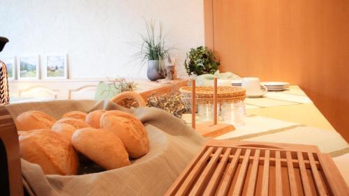 a basket of bread sitting on a table at Pension Eichertstüberl in Furth im Wald