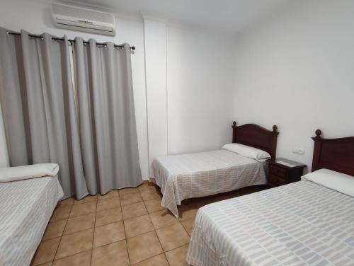 Katil atau katil-katil dalam bilik di Hostal Mellizo
