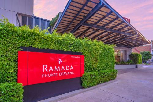 a sign in front of a building at Ramada by Wyndham Phuket Deevana in Patong Beach