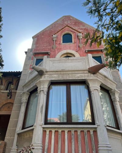 a building with a window on top of it at Esclusivo appartamento- 6 persone in Villa Liberty in Venice-Lido