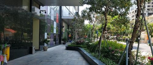 an empty sidewalk in front of a building at Gold Coast Luxury Apartment Nha Trang in Nha Trang