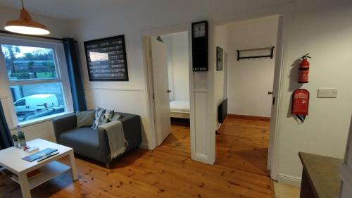 a living room with a couch and a table at 1780 Green Street in Dingle