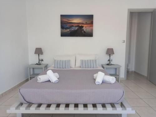 Säng eller sängar i ett rum på WONDERFULL SEA VIEW II