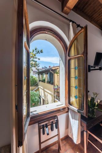 a window in a room with a view of a house at Residenza Il Villino B&B in Florence