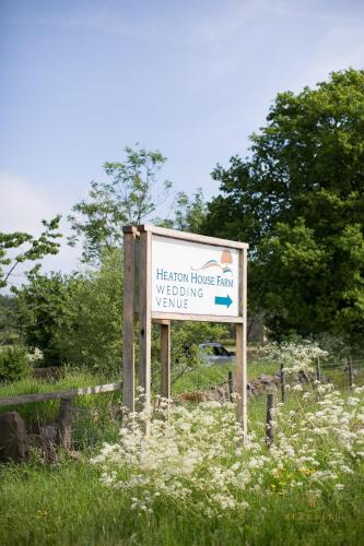 a sign for a hegew house farm wedding venue at Heaton House Farm in Macclesfield