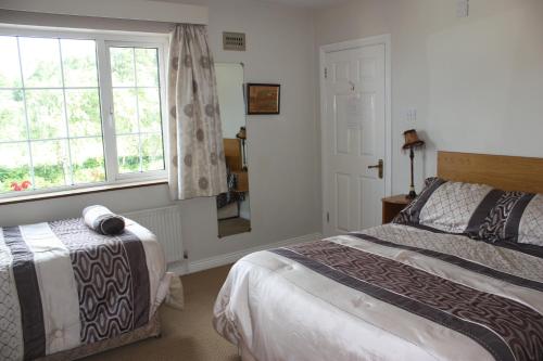 Ένα ή περισσότερα κρεβάτια σε δωμάτιο στο Cillcearn House