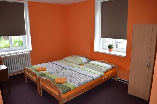 Кровать или кровати в номере Motorest Penzion na Bojišti