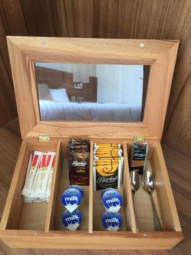 a wooden box filled with books and spoons at Cill Bhreac House B&B in Dingle