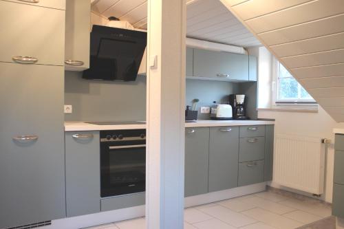 a kitchen with a sink and a stove at Biberland in Kleinkötz
