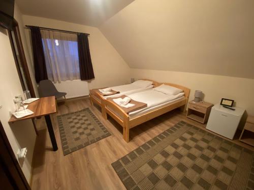 Postel nebo postele na pokoji v ubytování Grádics Panzió