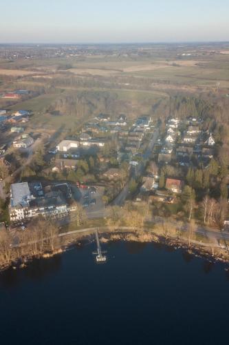 an aerial view of a village next to a lake at Schöne Unterkunft in Mühbrook in Mühbrook
