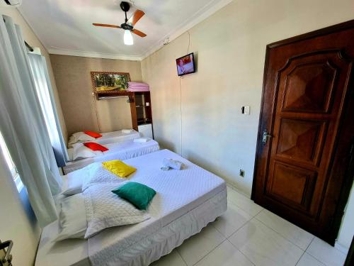 Cama ou camas em um quarto em Pousada Aconchego