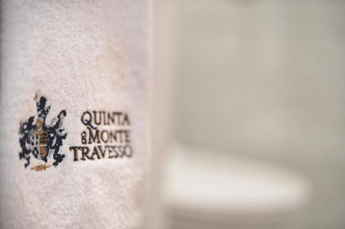 a close up of a tattoo on a persons leg at Quinta do Monte Travesso - Country Houses & Winery in Tabuaço