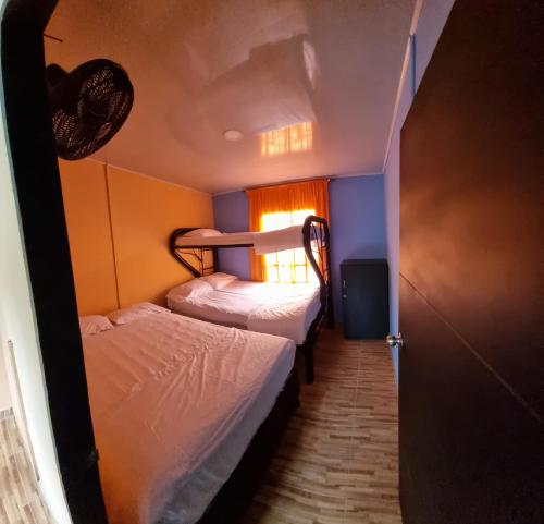 מיטה או מיטות בחדר ב-Villa Bruselas