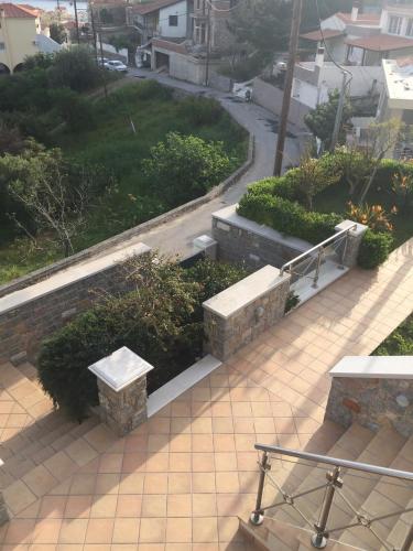 an overhead view of benches on a city street at villa bel horizon in Chios