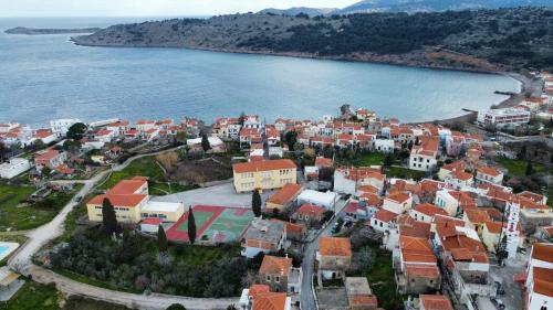 an aerial view of a town next to a body of water at villa bel horizon in Chios