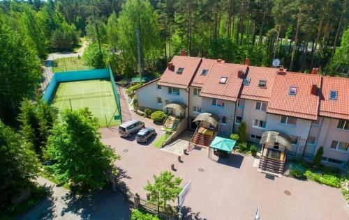 an aerial view of a large house with a parking lot at Idilė Bed & Breakfast - Visaginas in Visaginas