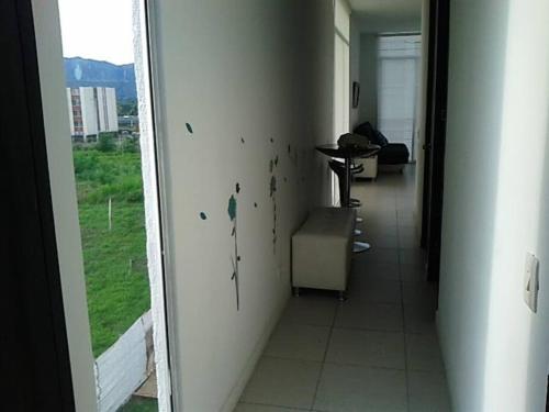 a hallway with a view of a room with a window at Apartamento Vacacional Flandes in Flandes