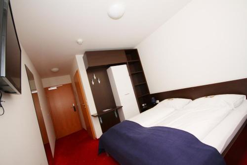 Ein Bett oder Betten in einem Zimmer der Unterkunft Hotel-Gasthof Restaurant Murblick