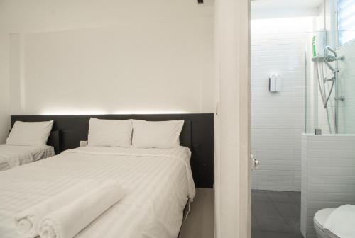 Кровать или кровати в номере The Nimman Hotel - SHA Plus