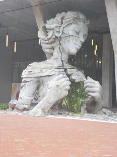 a statue of a lion in front of a building at A Treasure In Boynton Beach in Boynton Beach