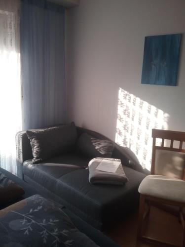 a living room with a couch and a table at Schöne Aussicht in Vöhl