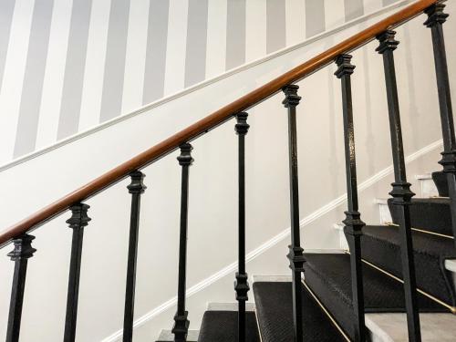 a set of stairs with black railings at Villa Berlioz in Nice