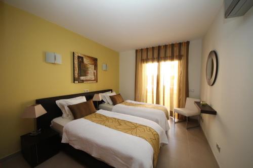 Posteľ alebo postele v izbe v ubytovaní Mar da Luz, Algarve