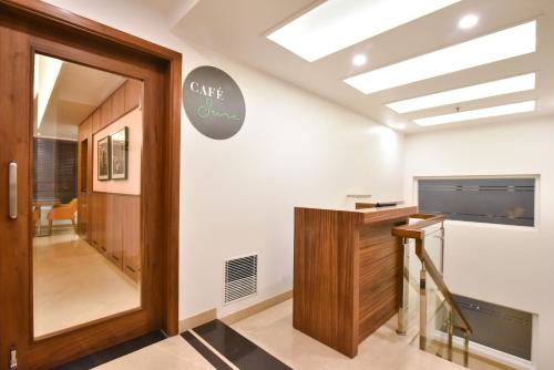 an office with a glass door and a skylight at SureStay by Best Western Heritage Walk in Amritsar