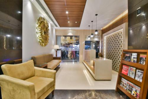 a lobby with couches and chairs in a store at SureStay by Best Western Heritage Walk in Amritsar