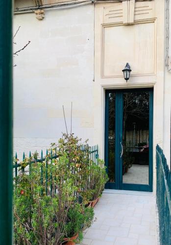 a doorway to a building with a blue door at Casa Midori in Lecce