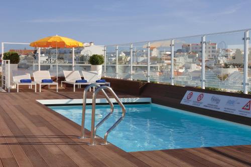 a swimming pool on the roof of a building at Hotel Marina Rio in Lagos