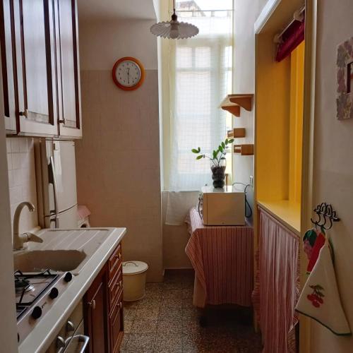 a kitchen with a sink and a window at La Dimora del Porto in Bisceglie