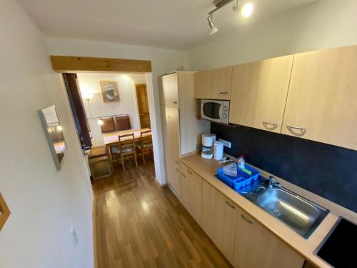 a kitchen with a sink and a counter top at Neubauernhof in Schwarzenbruck