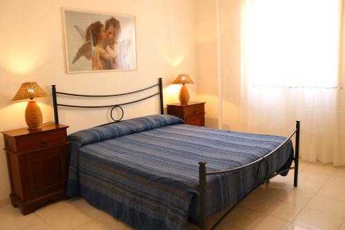 Postel nebo postele na pokoji v ubytování Appartamento a due passi dal mare