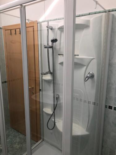a shower with a glass door in a bathroom at das Loft in Bad Kleinkirchheim