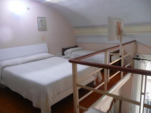 Postel nebo postele na pokoji v ubytování I Papiri B&B Aparthotel