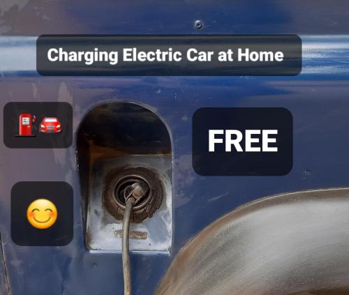 a close up of a charging electric car at home at Lopes Apartment - Belch1952 in Lagos