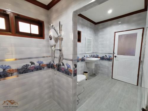 a bathroom with a shower and a toilet at Sand-D House Pool Villa A7 at Rock Garden Beach Resort Rayong in Mae Pim