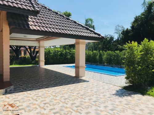 a pavilion with a pool in a backyard at Sand-D House Pool Villa A7 at Rock Garden Beach Resort Rayong in Mae Pim