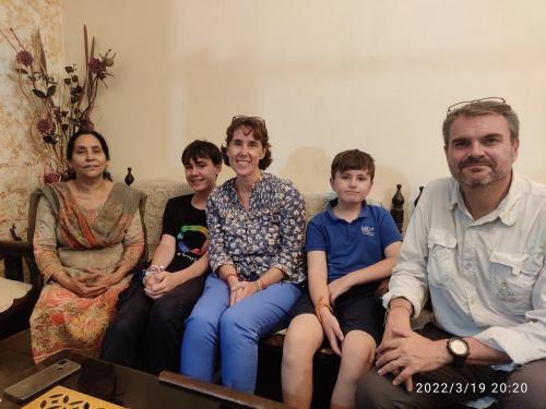 a group of people sitting on a couch at Max Guest House in Agra