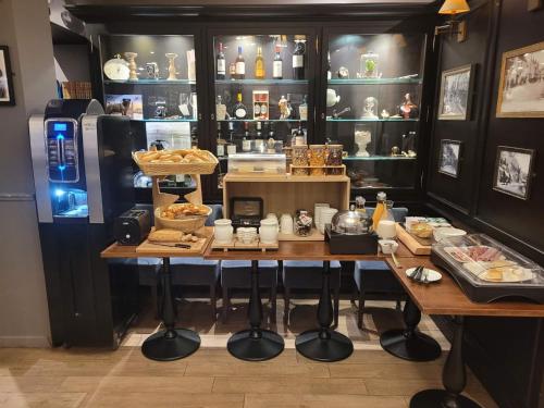 a bakery with a table with food on it at Hôtel Villa Des 2 Caps in Wimereux