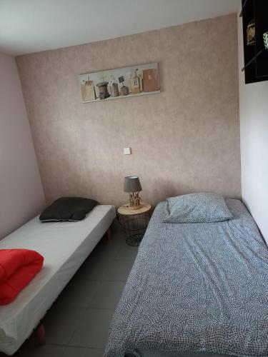 Ένα ή περισσότερα κρεβάτια σε δωμάτιο στο Le Relais De La Chaussee