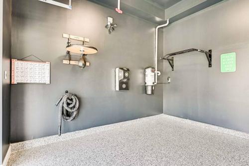 a room with a shower with aperature at Lux 5BD - Theater, Gym, Game Room, Parking & more! in Ashburn